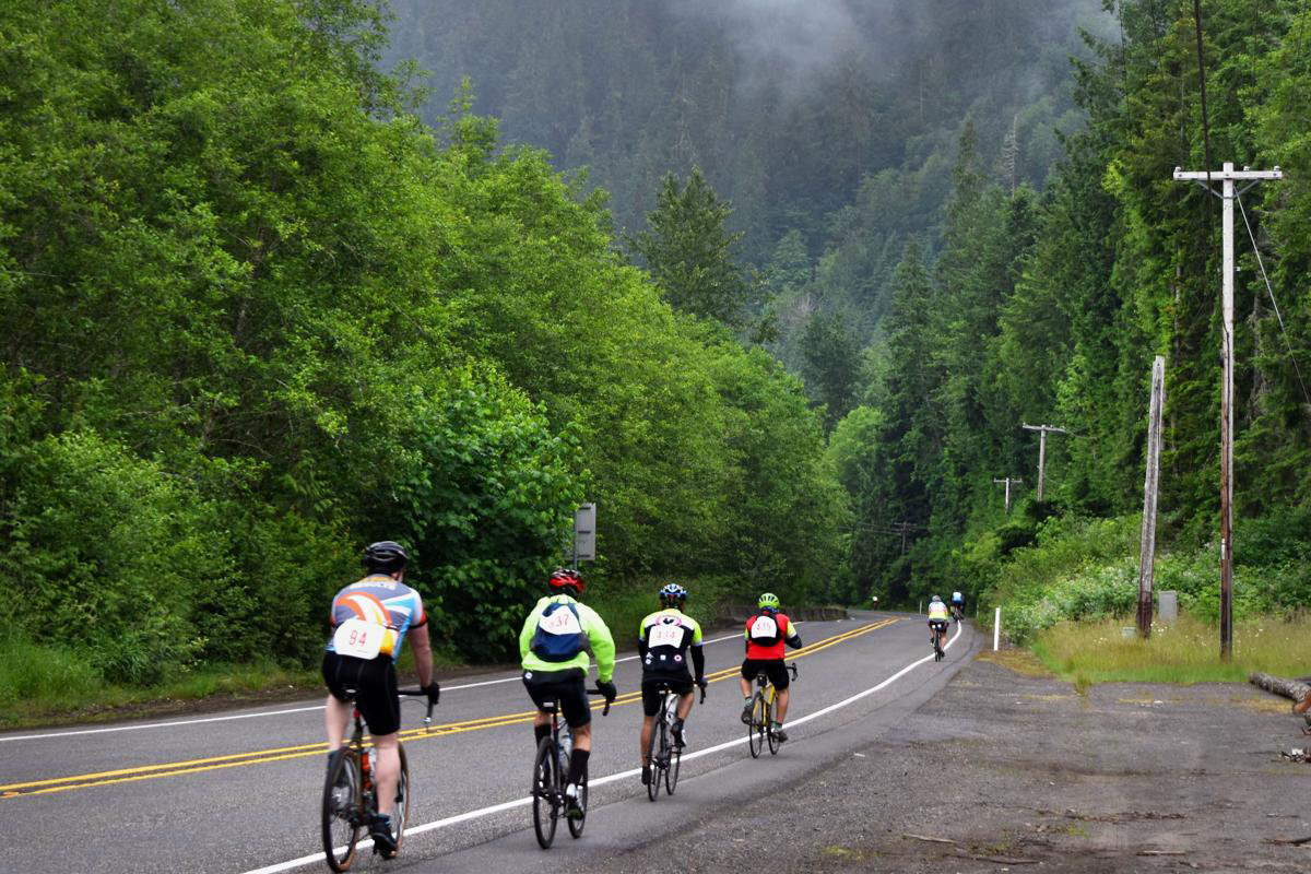 Bikers ride toward Hoffstadt Bridge after leaving Toutle Lake High School during the 26th annual Tour de Blast in June 2019.